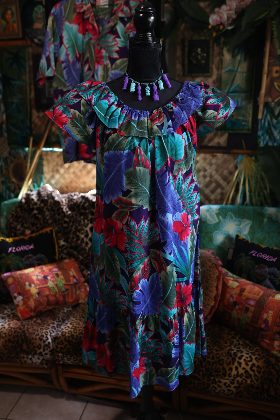 Colorful floral-patterned fabric on a table with a dark background